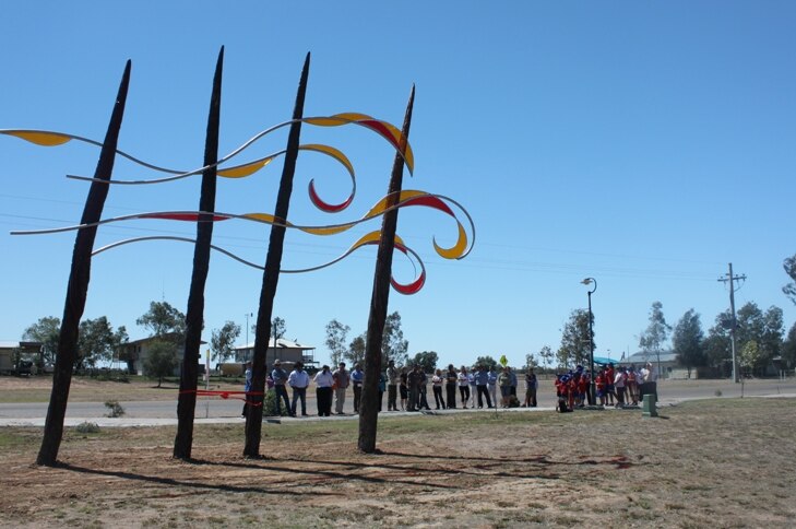 Crowd gathers around Indigenous artwork at Bedourie in far south-west Queensland.