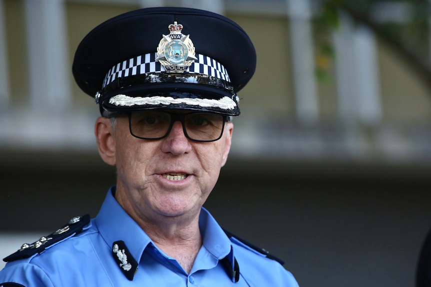 The commander speaks in front of a blurred out background.