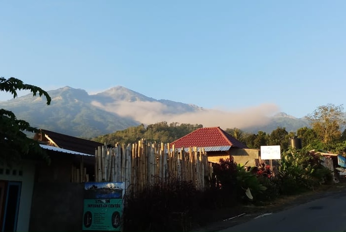 Dust in the air above mountain in the distance