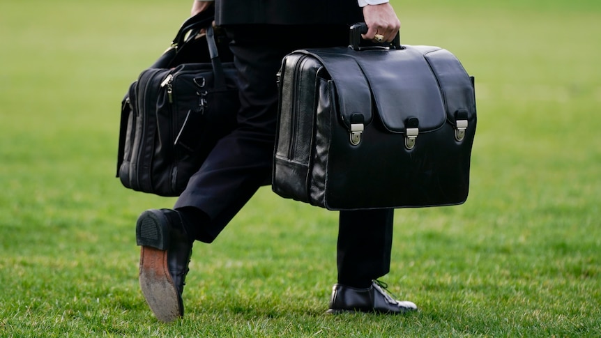 Mysterious Black Briefcase Follows US President