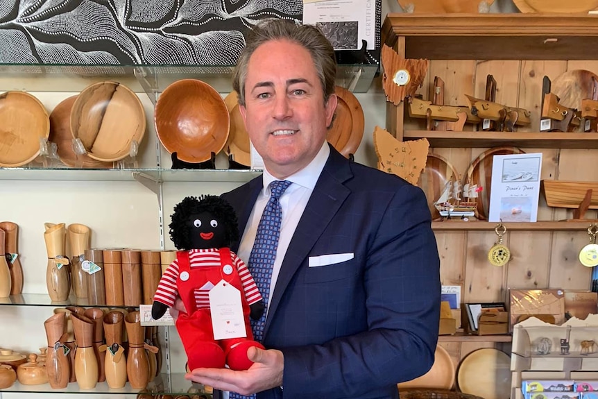 Brendan Blomeley with a golliwog.