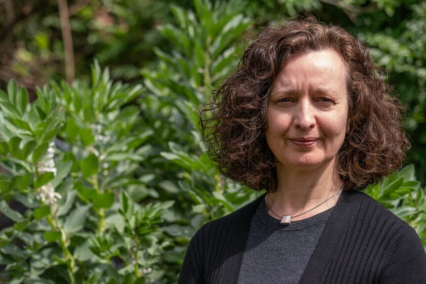 Dr Rachel Carey, a food systems expert from the University of Melbourne, stands on an urban farm