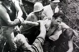 Bob Brown being manhandled by forestry workers at Farmhouse Creek, Tasmania, in 1986.