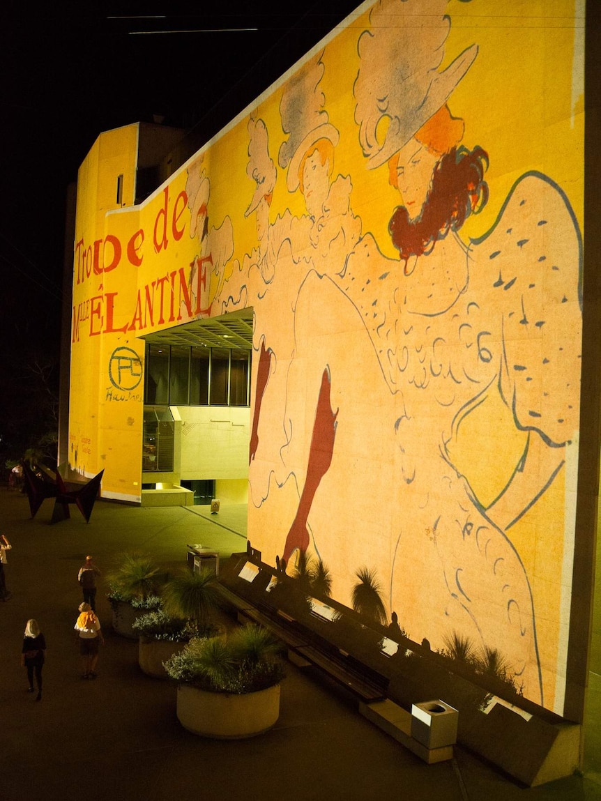 Images from Toulouse-Lautrec exhibition illuminate the side of the National Gallery for Enlighten Canberra.