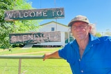 Tom King standing in front of 'welcome to Glendilla' sign.