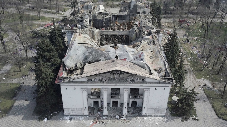 Aerial view of a near-flattened neoclassical theatre in Mariupol, Ukraine. Its front Grecian facade still stands.