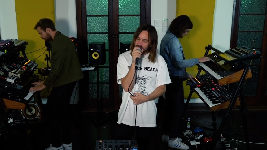 Screenshot of Kevin Parker and Tame Impala members performing in home studio