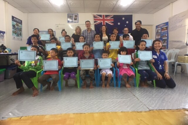 Karen refugees pose with their certificates for the Australian Cultural Orientation program.