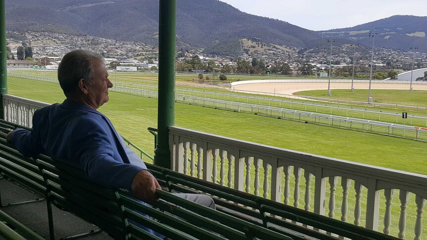 Greg Rider looks out over a race track