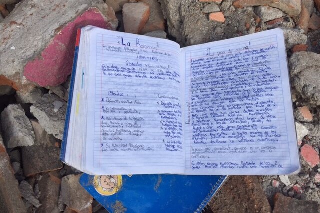 A child's homework lies in the rubble after the earthquake in Mexico.