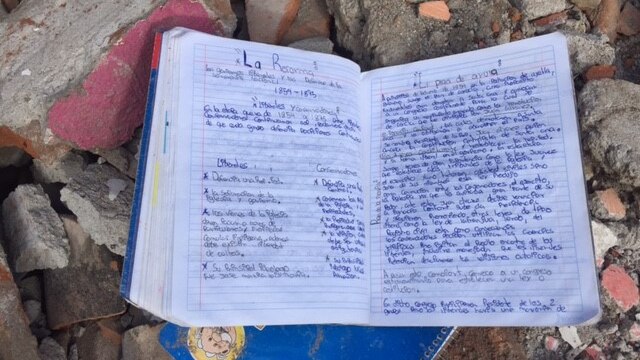 A child's homework lies in the rubble after the earthquake in Mexico.