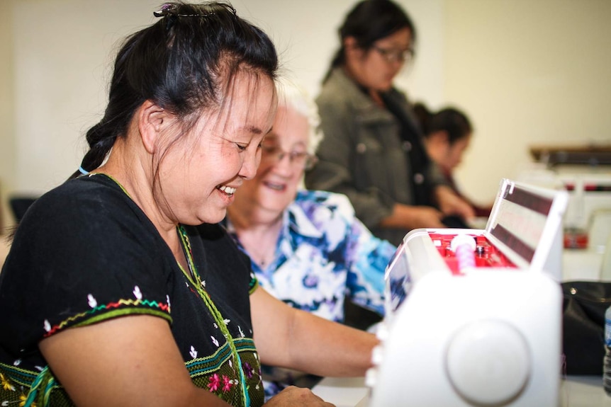 Reehta Say with her sewing tutor, volunteer Joy Deckert taking her through the paces.