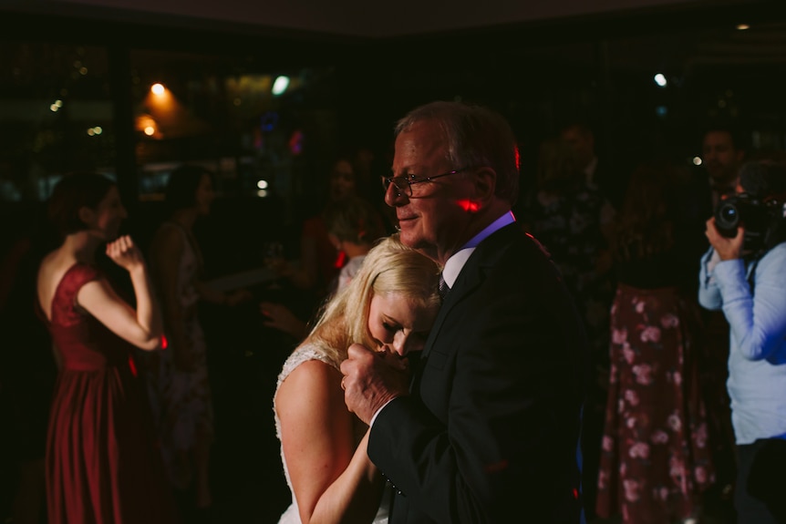 Holly Corbett and her father dance together on her wedding night.
