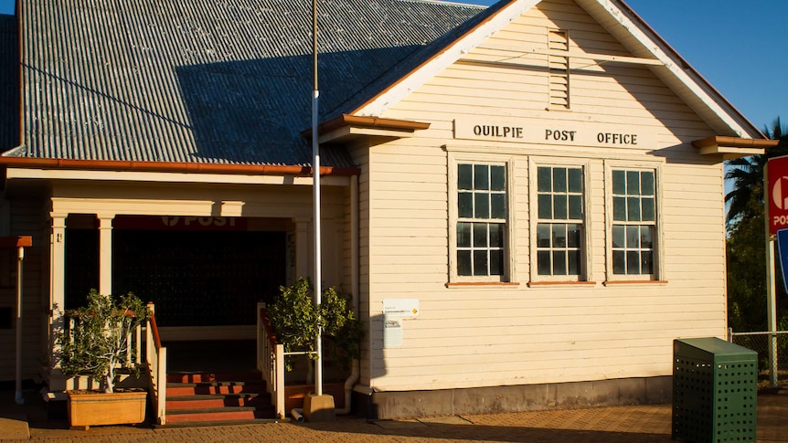 A photo of the Quilpie post office, a small single story timber building built in a colonial style.