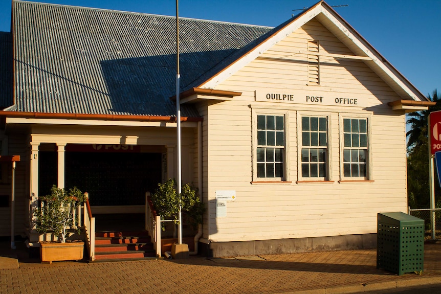 A photo of the Quilpie post office, a small single story timber building built in a colonial style.