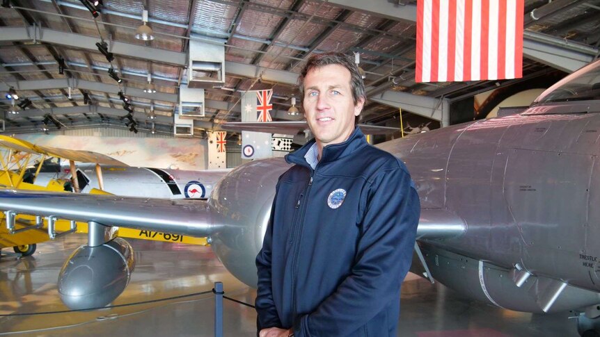 Temora Aviation Museum General Manager Peter Harper standing in front of aircraft