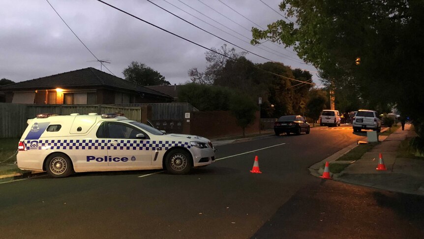 A police car blocks a street in Ringwood after a man was found shot dead in a driveway.