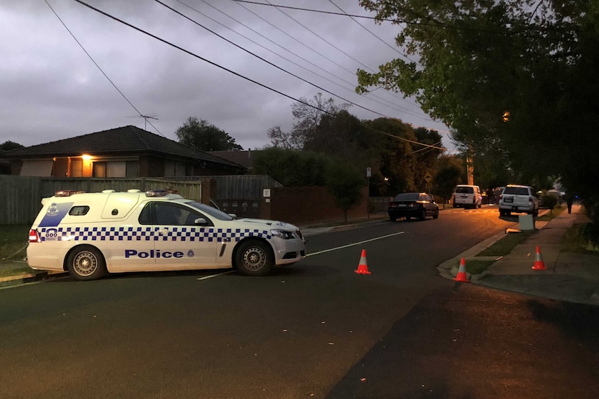 A police car blocks a street in Ringwood after a man was found shot dead in a driveway.