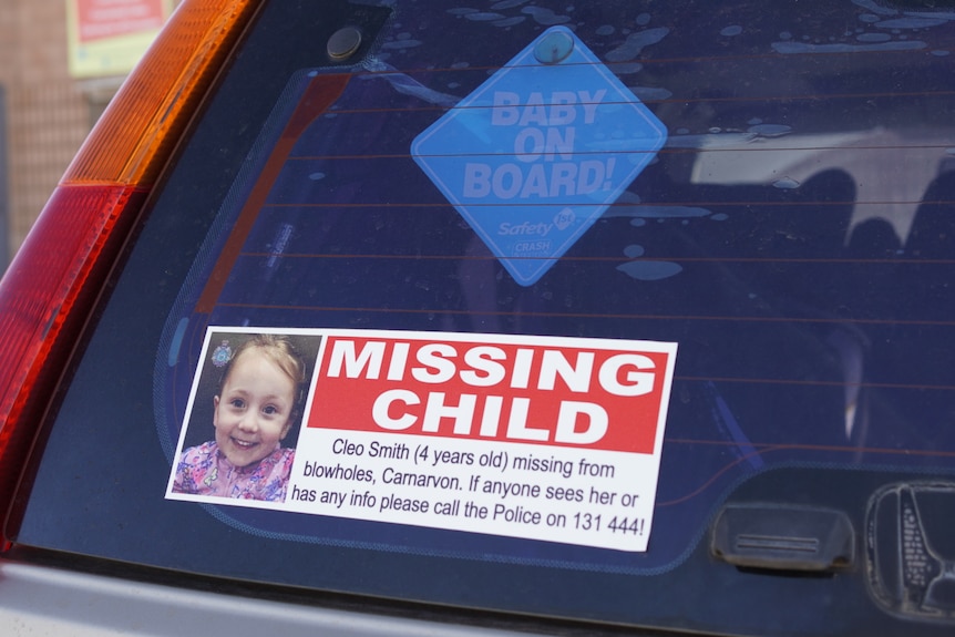 A close-up of a bumper sticker that says 'missing child' with a photo of Cleo Smith.