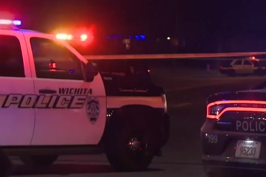 American police cars with Wichita Police branding at night.