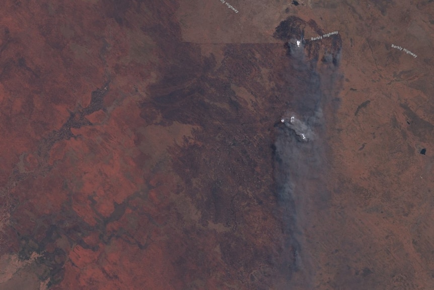 A satellite image of a huge area burned by fire.