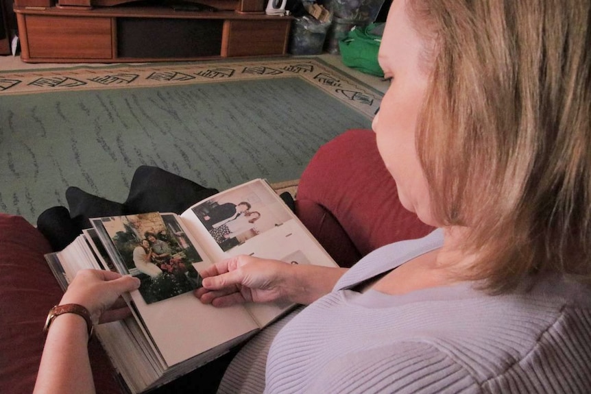 Susan Reilly looks at photos of her mum