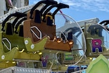 Seat with yellow tape on it where woman was sitting in on the Hangover ride at Cairns showground in Far North Queensland