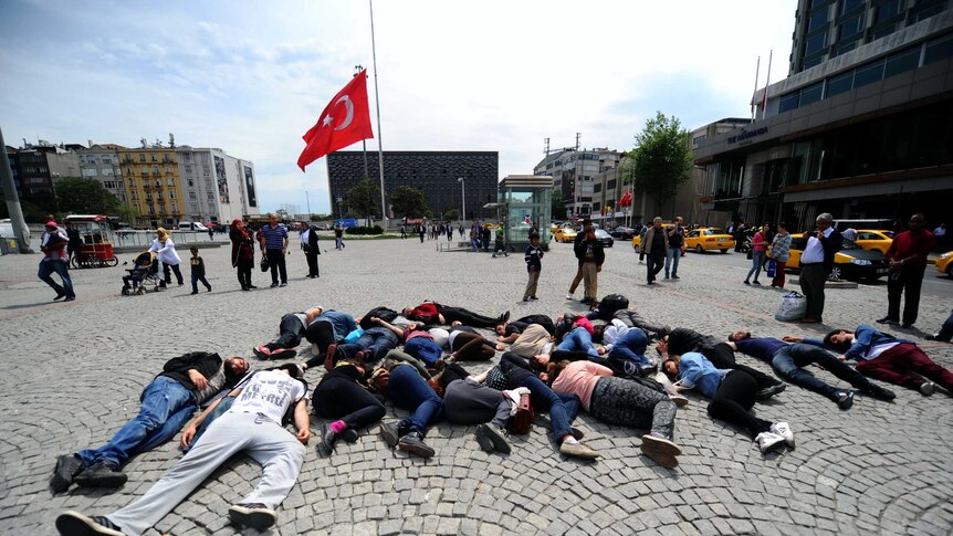 Turkish protesters lie down in Taksim Square