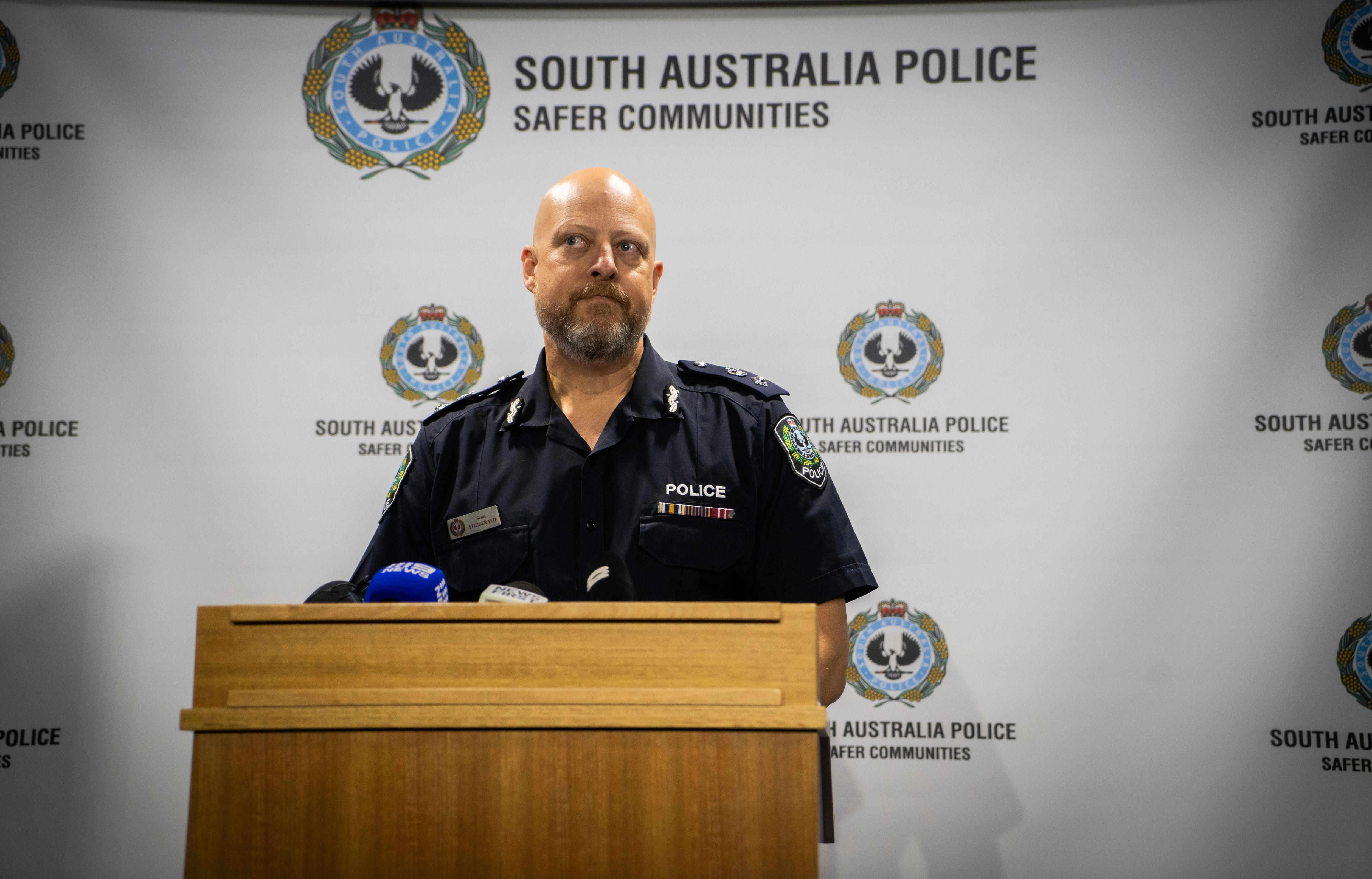 Police officer speaking at a press conference