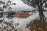 A house covered by flood water