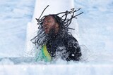 Nic Naitanui sahkes his hair as he comes out of the ice water at the Big Freeze at the 'G.