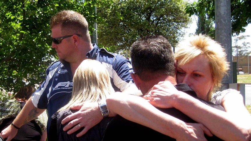 Relatives of the Rowe family gather outside the Elizabeth Magistrate's Court in Adelaide.