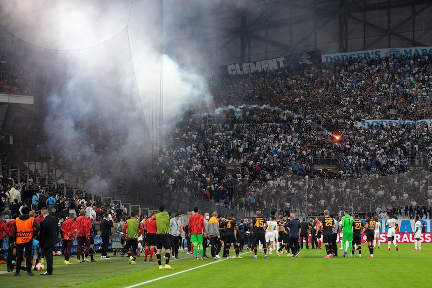 A flare is thrown at Marseille fans