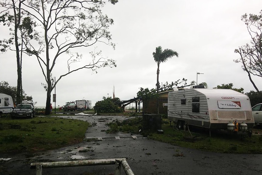 Caravans and fallen tree branches at a Hervey Bay caravan park