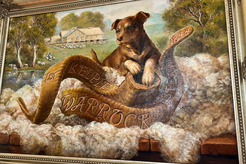 a framed painting of a brown kelpie dog 