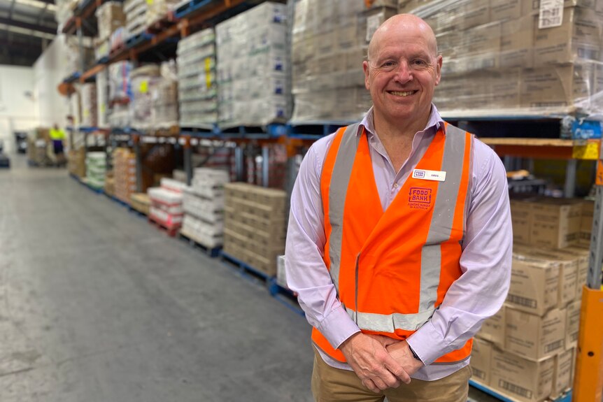 Foodbank CEO Greg Pattinson at a warehouse.