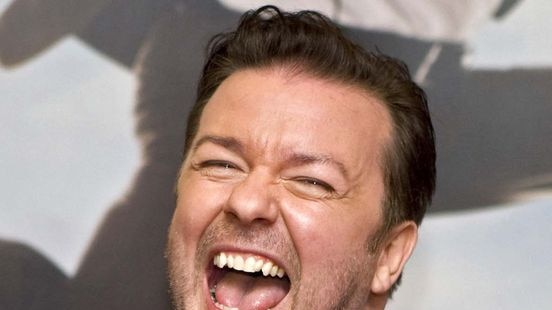 British actor Ricky Gervais laughs while posing for photos
