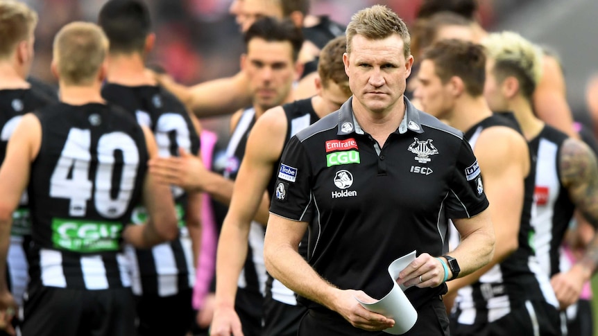 Collingwood coach Nathan Buckley walks off the ground during the match with Essendon at the MCG