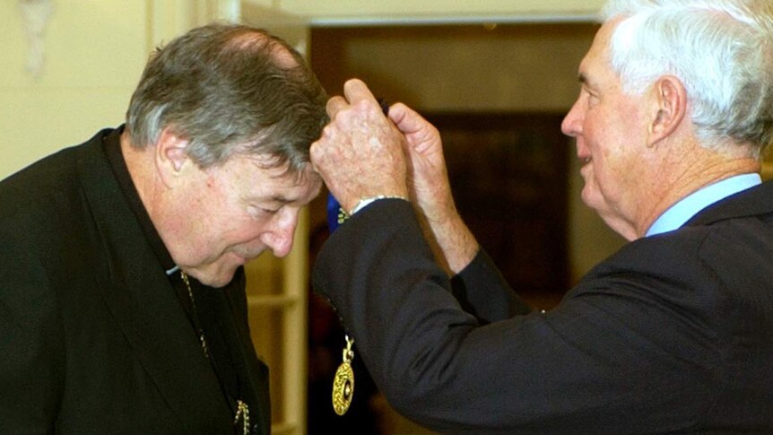 George Pell receives the Companion of the Order of Australia award from Governor-General Michael Jeffery