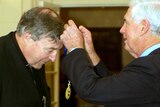 George Pell receives the Companion of the Order of Australia award from Governor-General Michael Jeffery