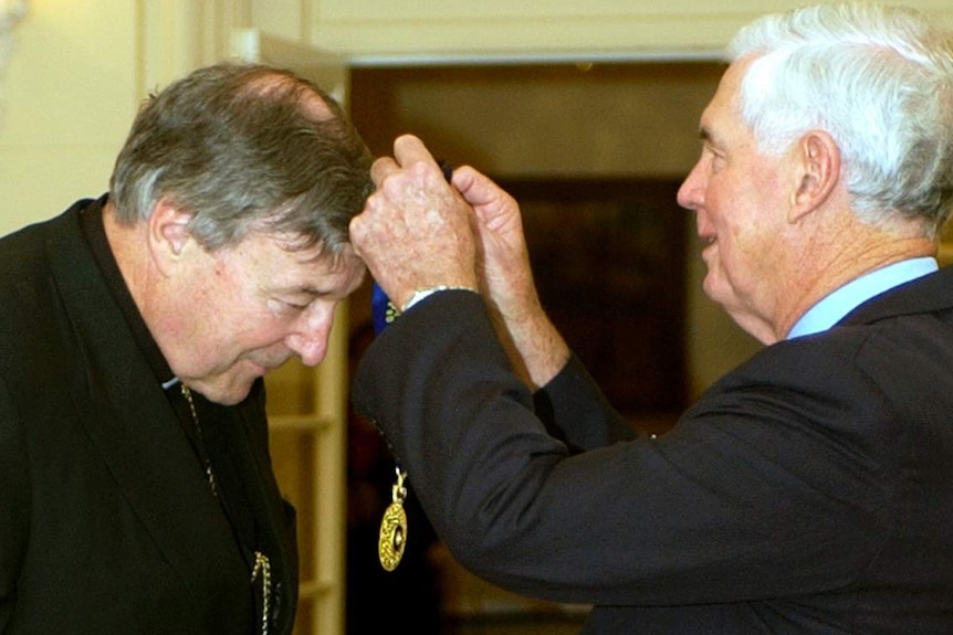 George Pell receives the Companion of the Order of Australia award from Governor-General Michael Jeffery