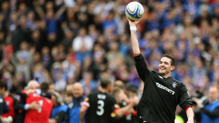 Triple threat ... Kyle Lafferty's hat-trick lifted Rangers to the title.
