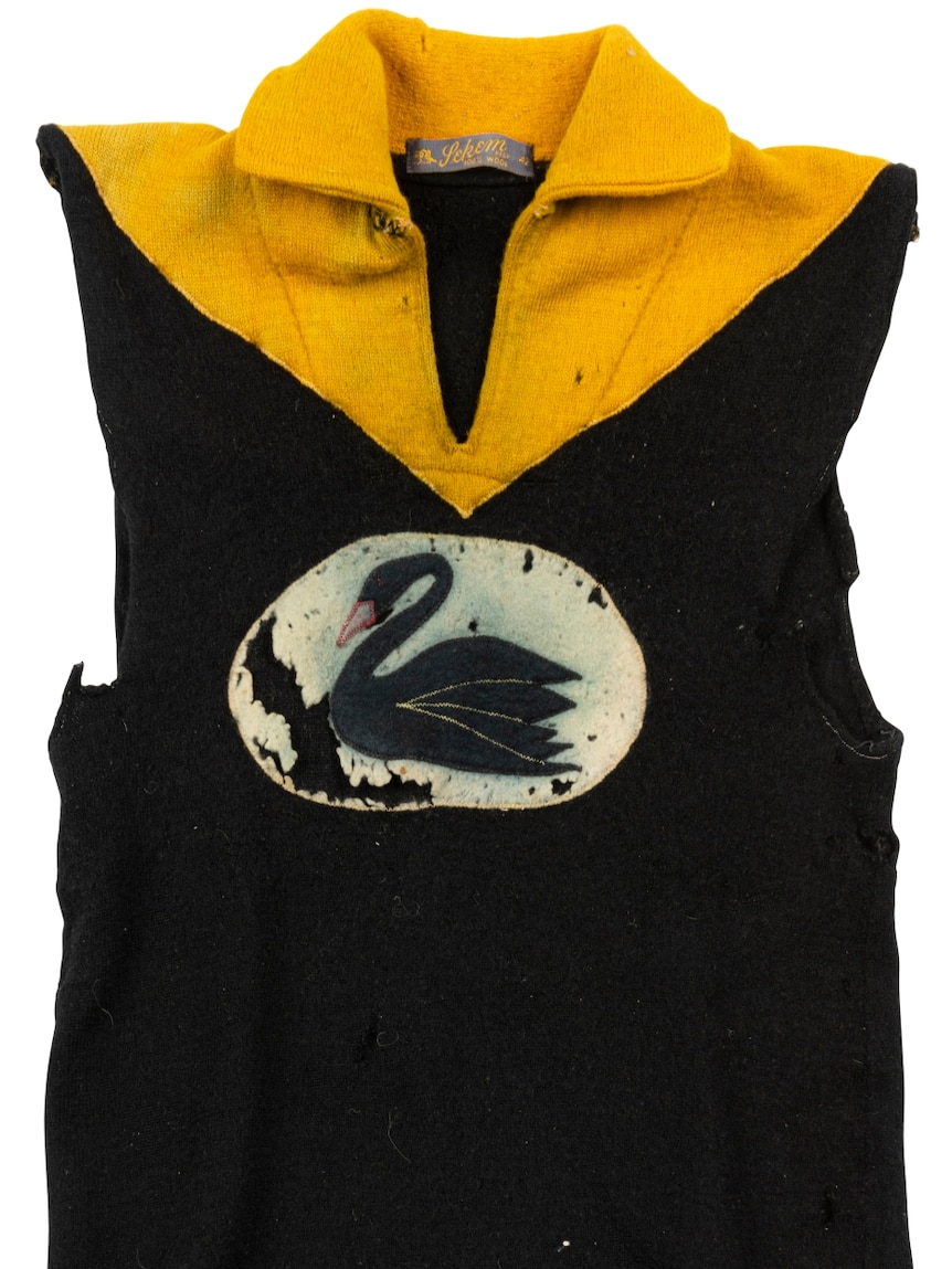 An image of a black and yellow WAFL jersey, with a swan on the front.