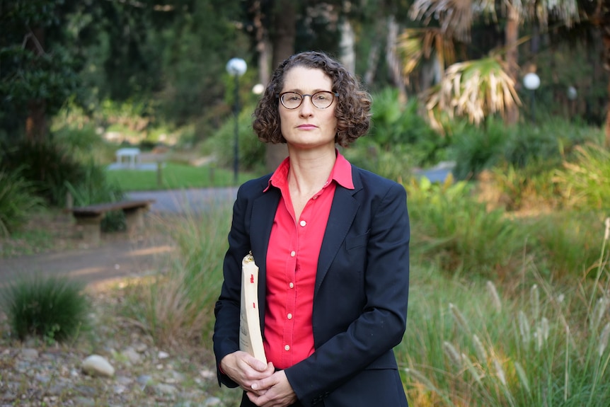 Dr Julia Quilter looking at camera.