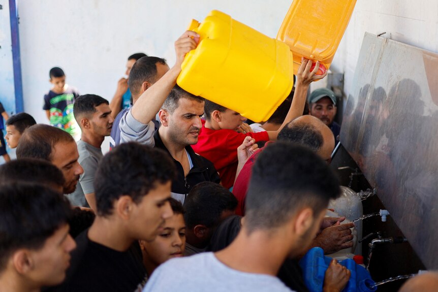 People gather to collect water. 