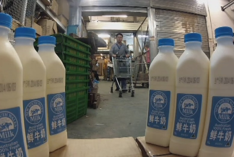 Milk bottles on a shelf.