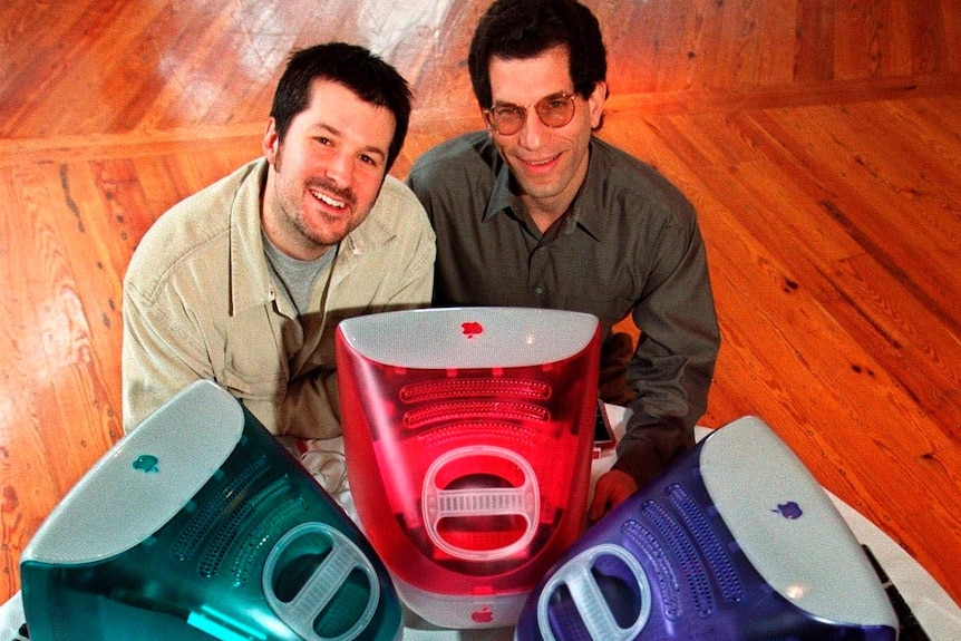 Jonathan Ive with Jon Rubinstein posing with iMac computers