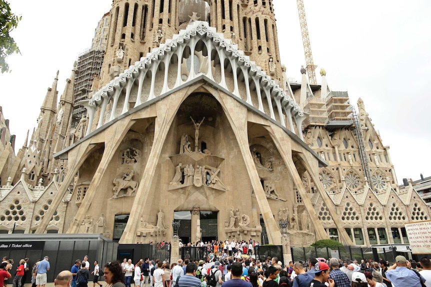 Crowds of people outside Barcelona's Sagrada Familia Basilica following a mass for the terror attack victims.
