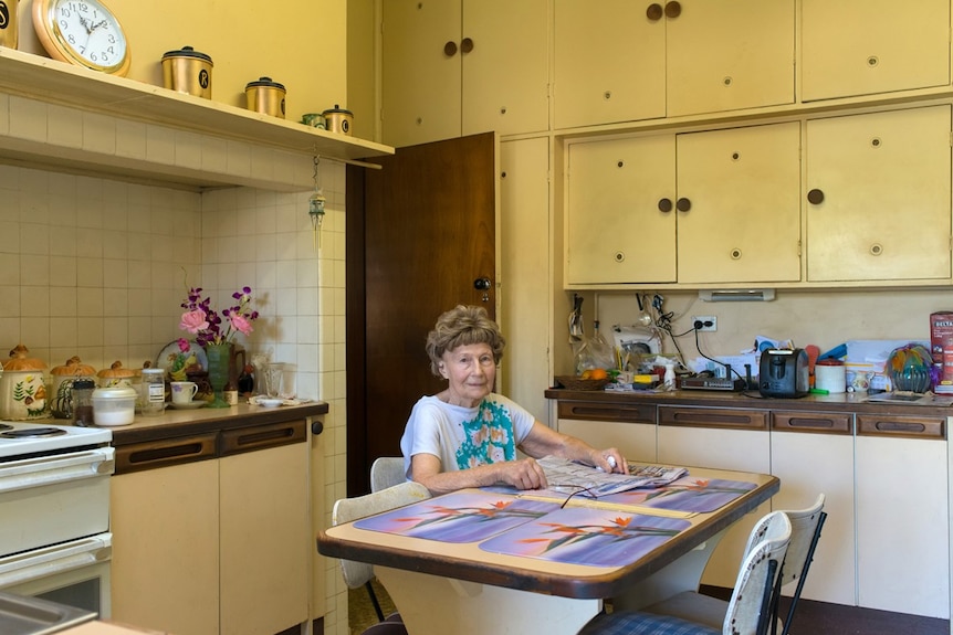 Woman sitting at kitchen table