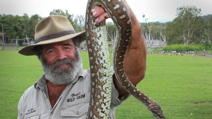 rob Bredl holdng a long snake